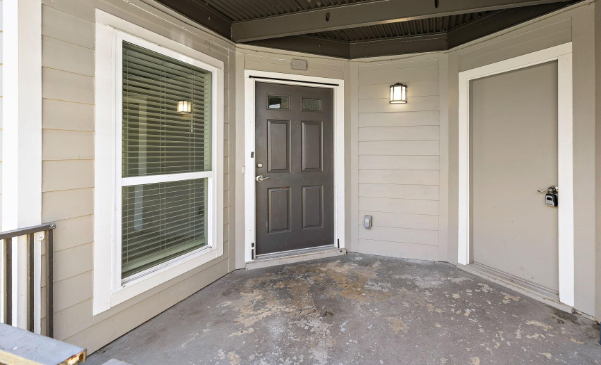 This unit's full-sized laundry room is located off of the patio. 