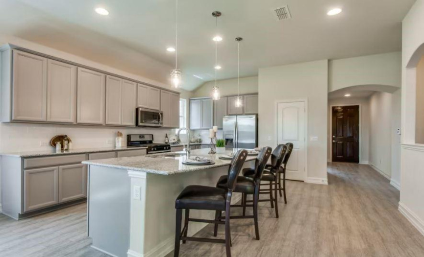 Photo of Pulte model home with same floor plan, not of actual home listed. 