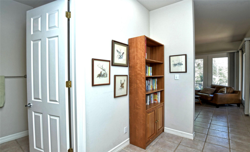 The primary suite has its own private hallway with the private commode. 