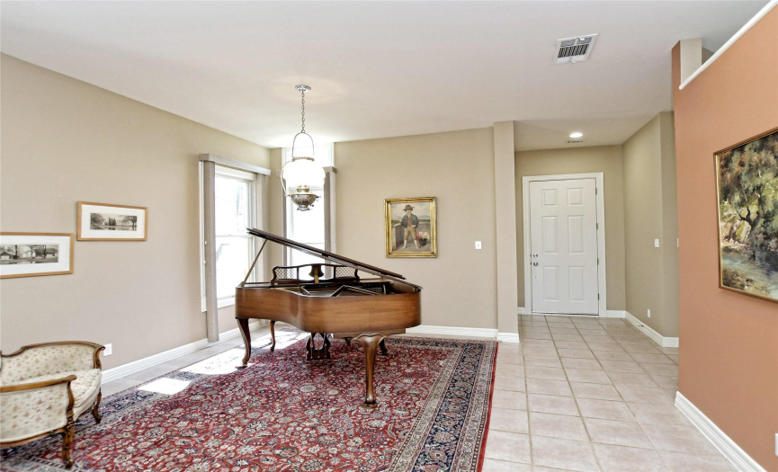 The front end of the great room offers flexibility for use of space and could easily be used as a front parlor, formal dining, piano area, and more. 