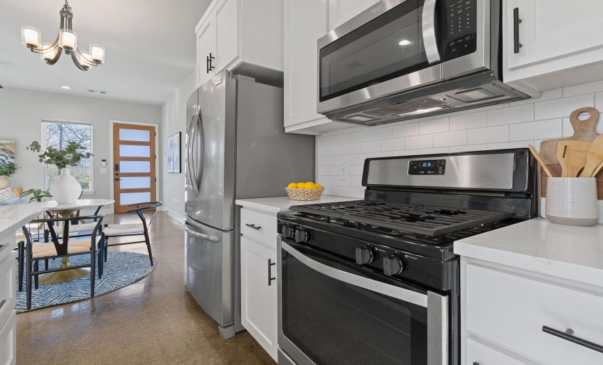 Easily stay connected with guests while preparing meals in the kitchen with this fabulous partially opened floor plan. 