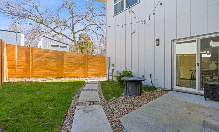 Enjoy outdoor living & entertaining with your own private fenced-in side & backyards, an al fresco patio, lush green lawn space, charming walkways, and well-placed xeriscape.