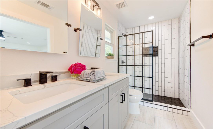 Another view of the beautiful master bathroom with its modern touches.