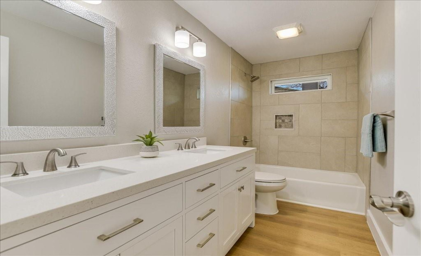 Second Bathroom with double vanity and quartz countertop.