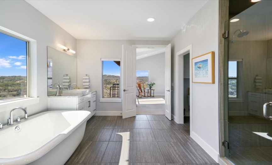 The sumptuous primary bath features two separate vanities, a free-standing soaking tub and a large shower with two shower heads and a large walk-in closet.  There is an additonal closet at the entry to the primary bedroom