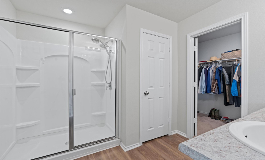 With attached bathroom, dual vanities, oversized shower and a walk-in-closet.