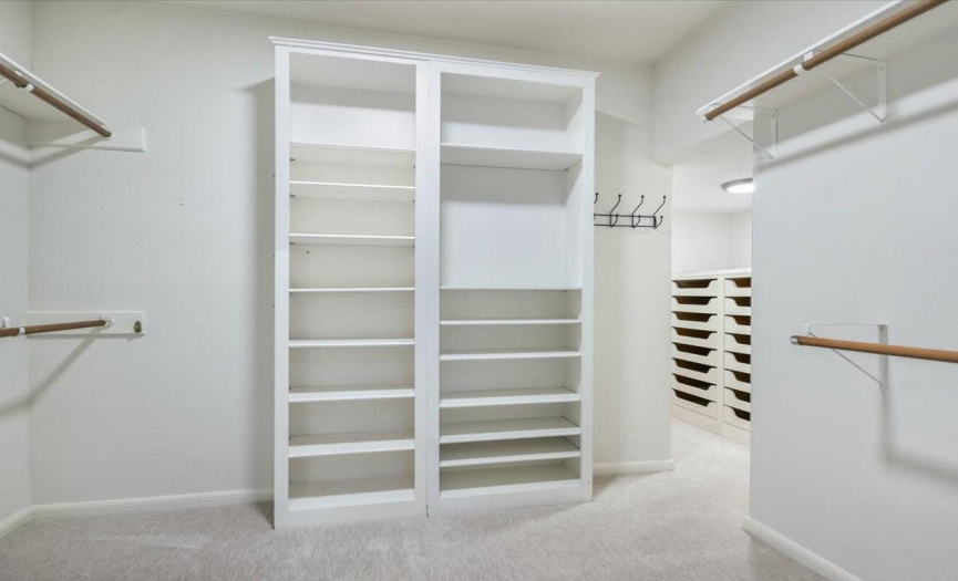 Revel in the custom walk-in closet, meticulously designed to accommodate your wardrobe with style and organization in mind.