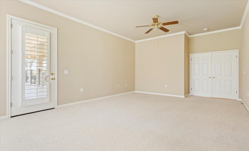 Primary Room has a grand entrance with two double doors.  Door to the left goes to patio.