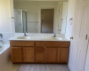 Double sinks in vanity with lots of storage cabinets below