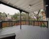 Covered backyard deck with greenbelt views!