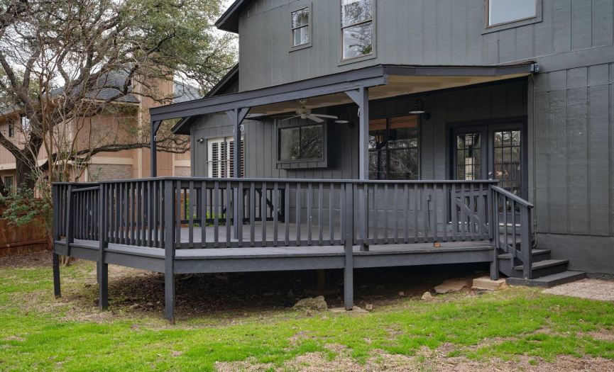 Covered backyard deck with greenbelt views!