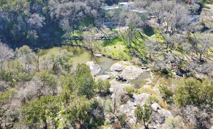 House backs up to stunning spring-fed creek! 