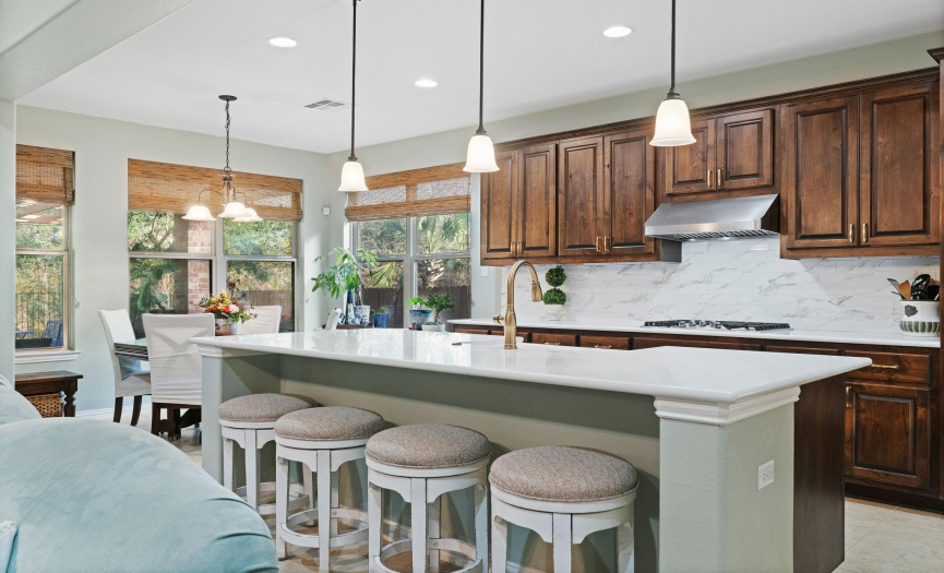 A large island takes center stage in the kitchen.