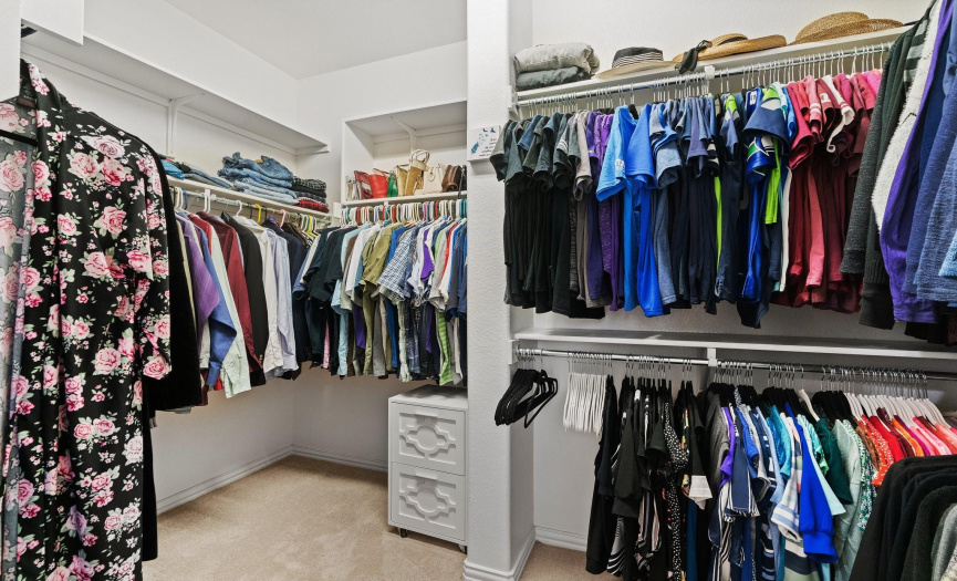 The closet of your dreams is equipped with abundant hanging and shelf space!