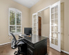 French doors at the entry of the home welcome you to a dedicated home office.
