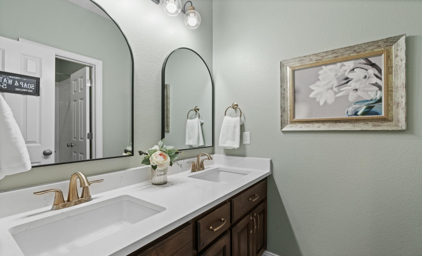 The full bath readily accessible to the third and fourth bedrooms includes a dual vanity and a separate room for the tub making it seamless for two people to get ready at once.