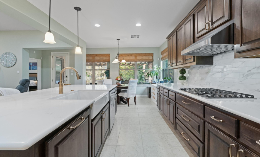 The kitchen opens to a large breakfast nook for casual dining.