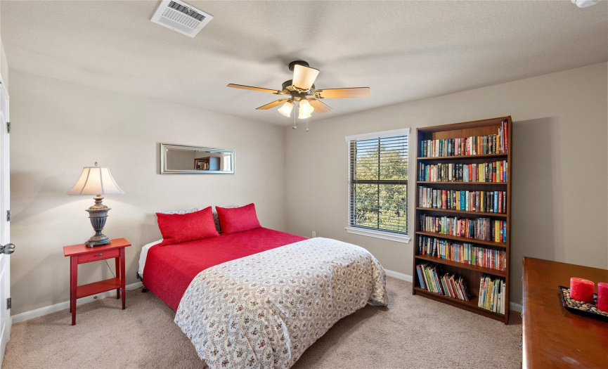 One of three generously sized secondary bedrooms located upstairs. 