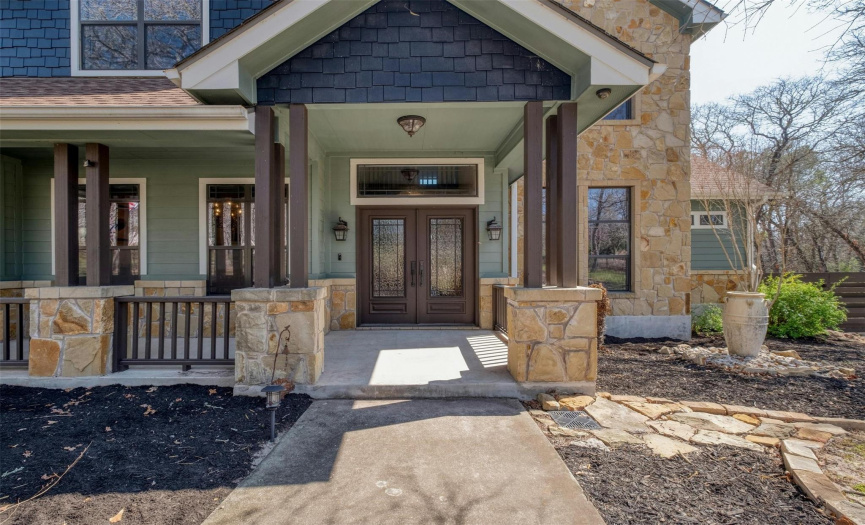 Step into elegance through the grand wrought iron double doors, where multiple French doors seamlessly merge indoor & outdoor living, bathing the living areas in natural light. 