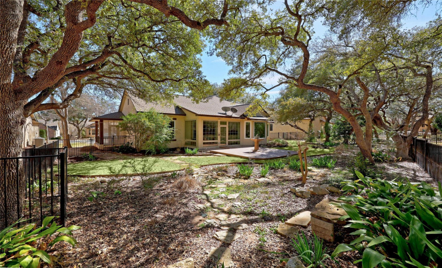 Back yard is fully fenced and nicely shaded under native Texas Live Oak tree canopies.