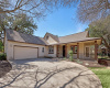 A side entry garage and a wrap around front porch add a unique curb appeal on this Sun City Brazos floor plan home!