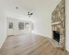 Living area with stone hearth and update Luxury Vinyl Plank floors