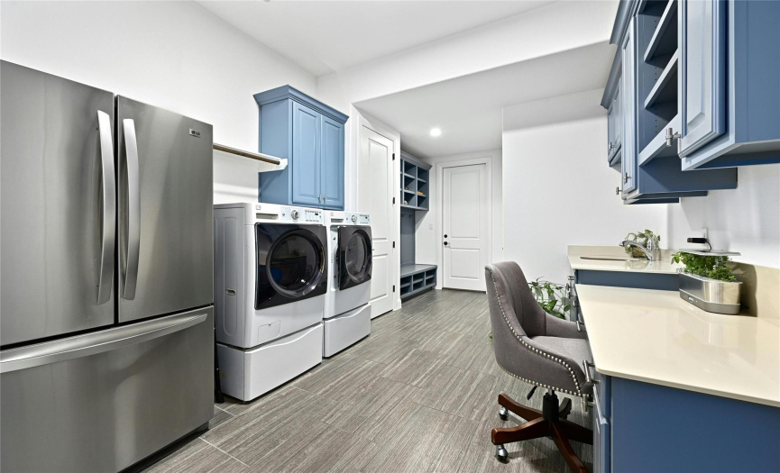 Plenty of room in this beautiful laundry rm.