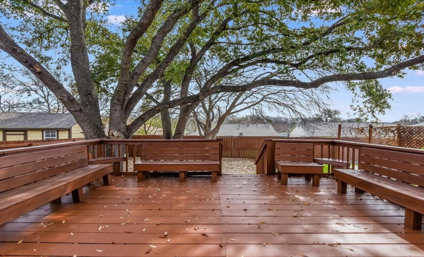 Relax on your back deck. Nice large shade trees offer shelter from the sun.