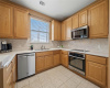 The kitchen has updated appliances and solid wood cabinetry with tons of counter space.