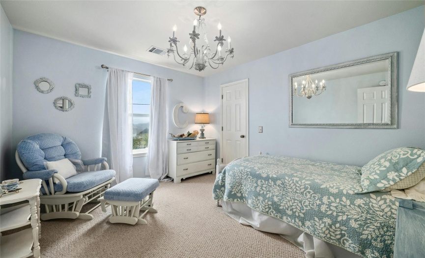 Your guests or kids will feel spoiled in this beautiful bedroom with walk in closet and views!