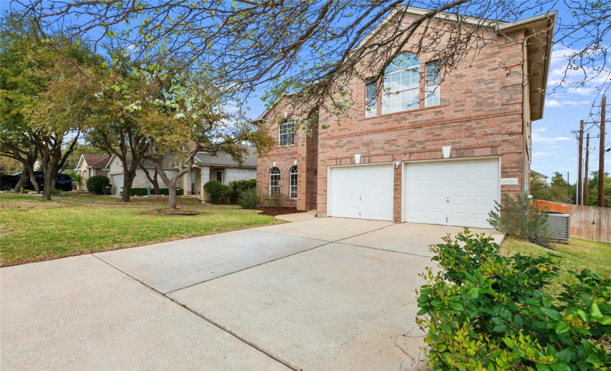 A long, flat driveway and a two-car garage provides ample parking. 