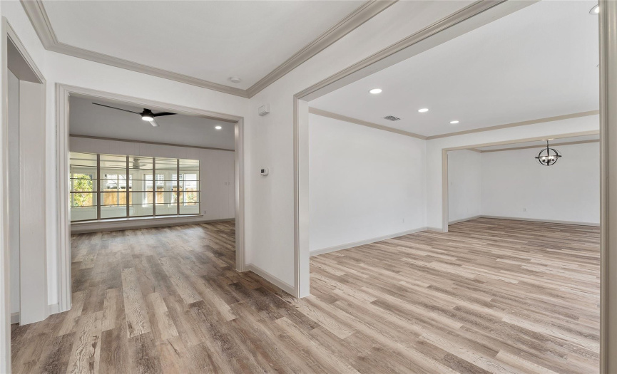 As soon as you enter this gorgeous well-maintained home you instantly notice all of the luxurious details and custom touches. The modern wood-looking luxury vinyl plank flooring throughout and the custom paint color choices makes this home feel very elegant.
