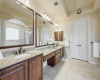 Large primary bath with dual sinks, walk in shower and jetted tub.