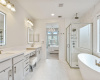Primary En-Suite Bathroom with Deep Soaking Tub + Standing Shower