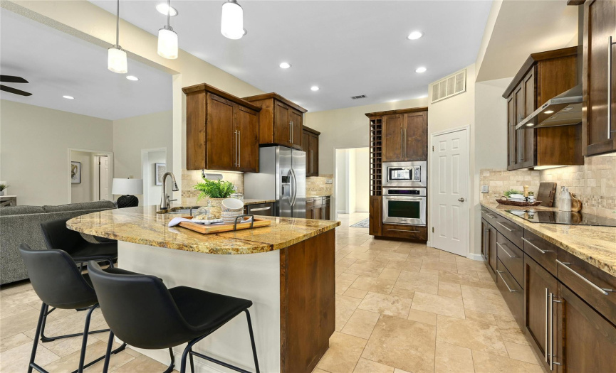 Kitchen with Granite Counters, Custom Cabinetry, Bill Pay Desk and Wine Rack