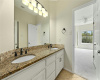 Hollywood Bathroom with Shower/Tub and Dual Vanity Granite Counters