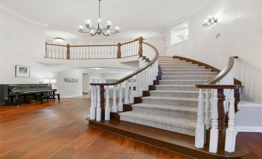 2 story entry with beautiful staircase leading to 2nd floor 
