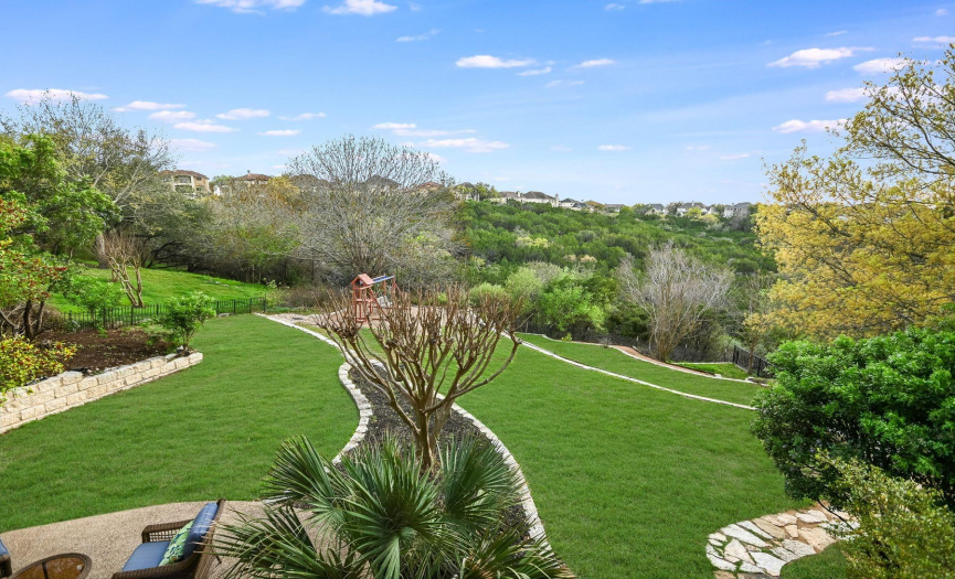 Sweeping hill country and nature preserve views from backyard