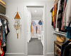 The spacious walk-in closet sits in between the primary bedroom and full bath. 