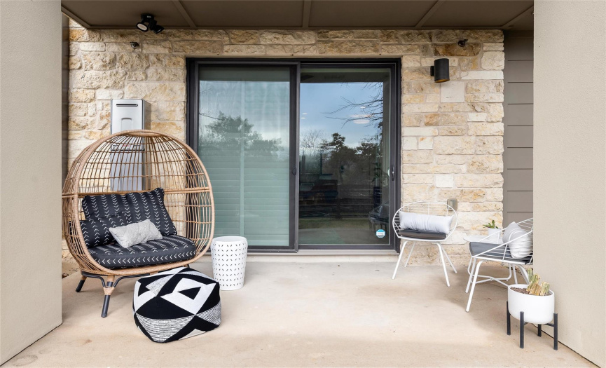 The covered patio provides plenty of space for you to configure your ideal outdoor living area where you can take in the peaceful views of the green space beyond your yard. 