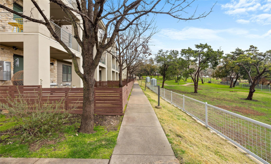 Step right out your back gate to enjoy the serene walking trails and gardens behind the condo.