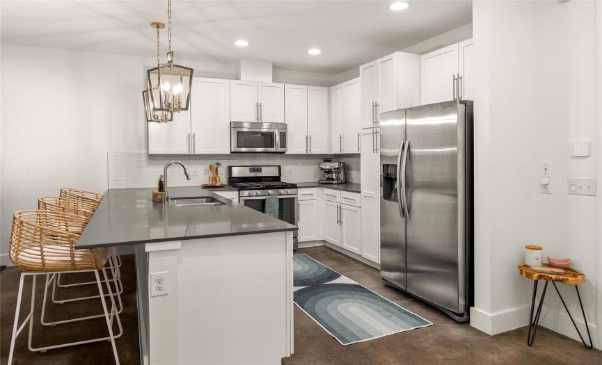 Featuring a gorgeous kitchen that comes complete with desirable modern finishes and plentiful cabinetry and counter space. 