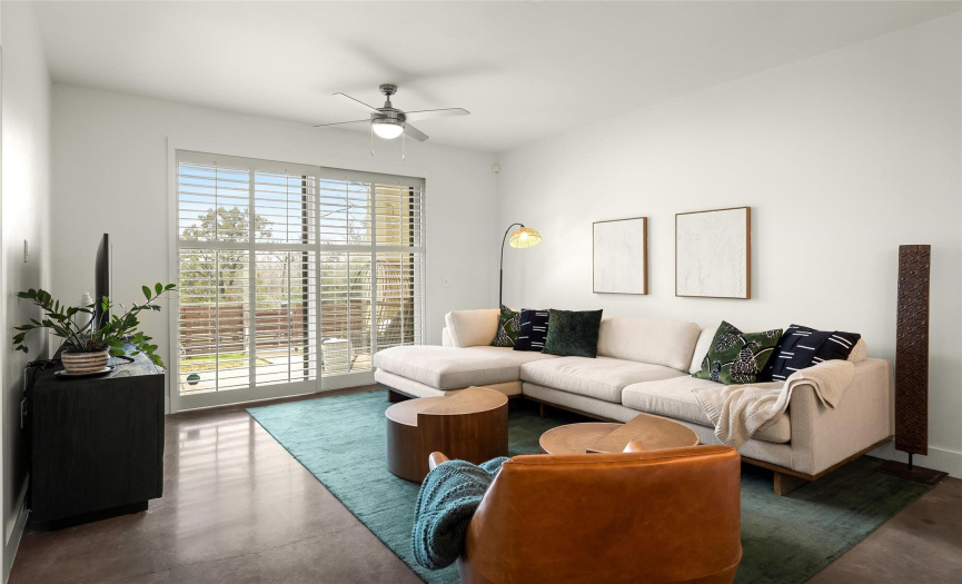 The interior is beautifully updated and features modern Kichler light fixtures and generously sized windows & sliders with custom plantation shutters.