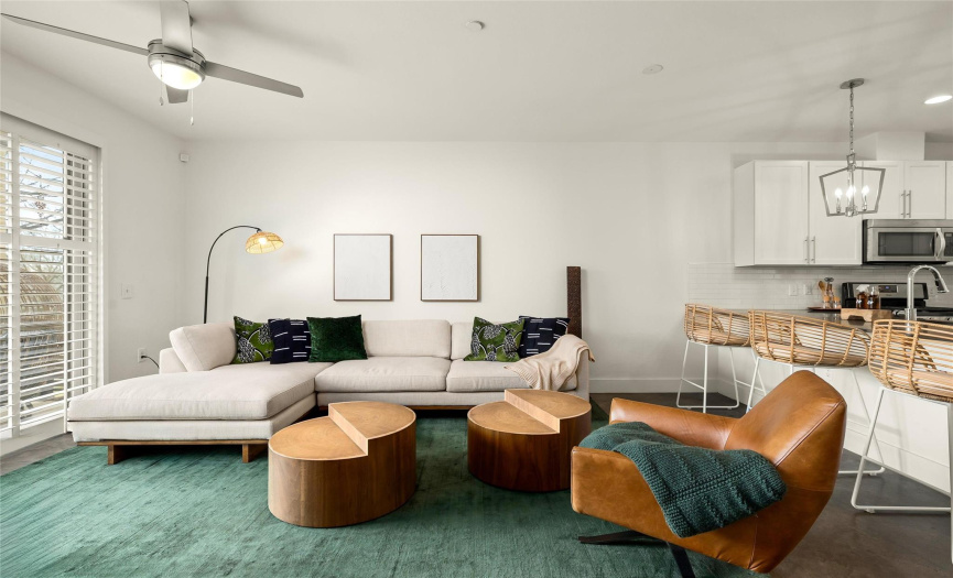 The welcoming living room offers an abundance of space to gather with friends and family.
