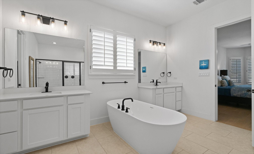 Enjoy your own private spa-like ensuite bath with separate vanities and a stunning freestanding soaking tub where you can soak away the day's stress.
