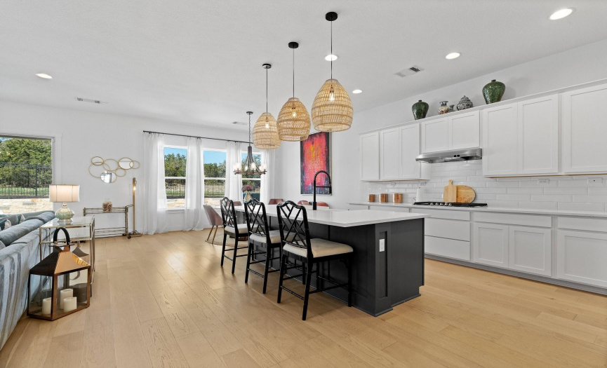The large entertainer's island in the kitchen provides casual seating that everyone will want to gather around.