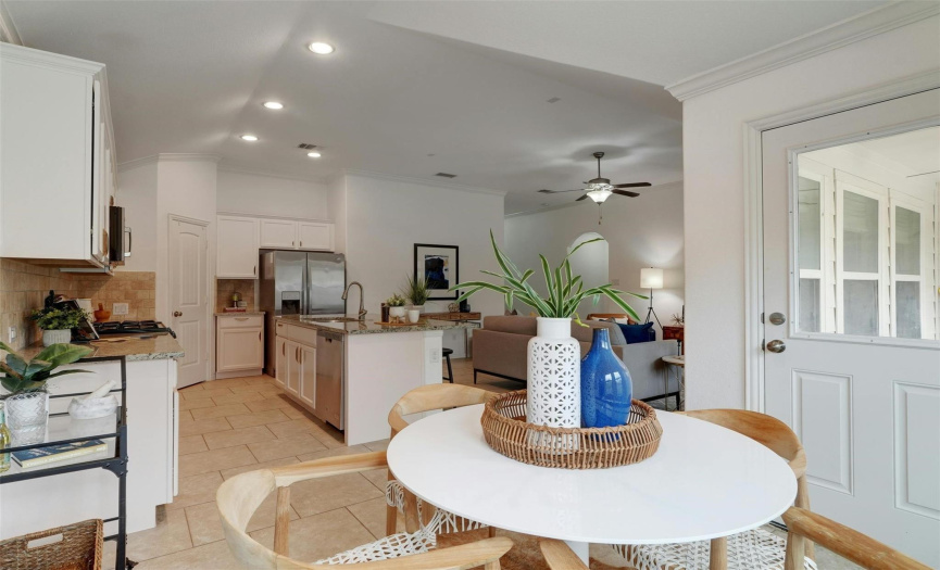 The dining area provides plenty of space for a sizable kitchen table of any shape where you can enjoy home cooked meals and make lasting memories with friends and family. 