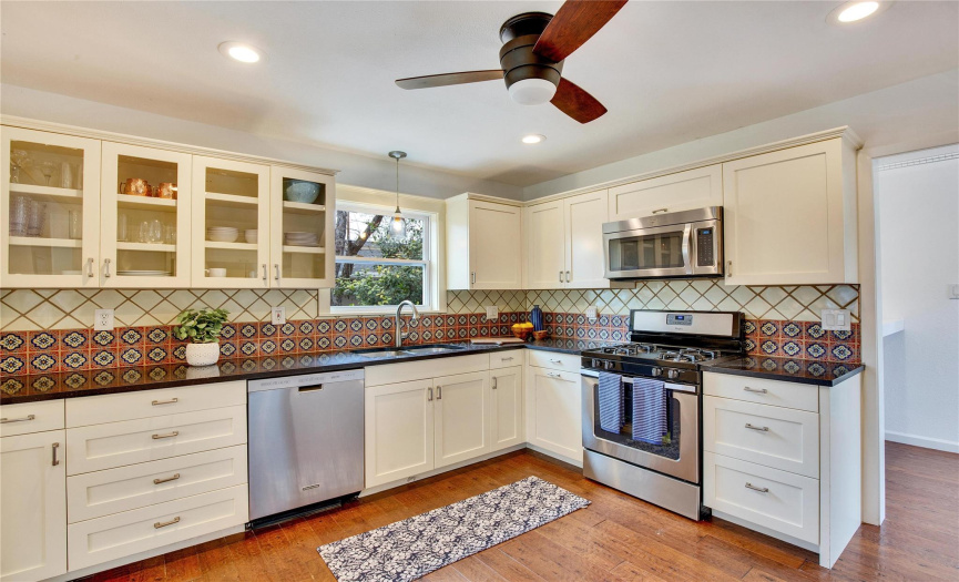 Nice Stainless Steel Appliances are throughout the kitchen, featuring a gas range for the culinary enthusiasts, and who doesn't love a window over the kitchen sink! 