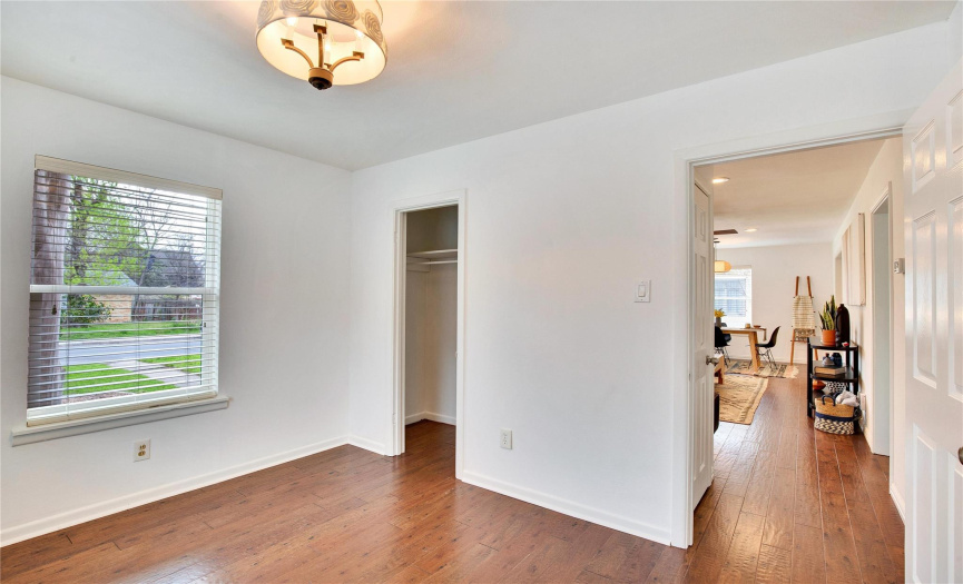 This 2nd bedroom is tucked away off the living room, separated by a short corridor with a coat closet. 