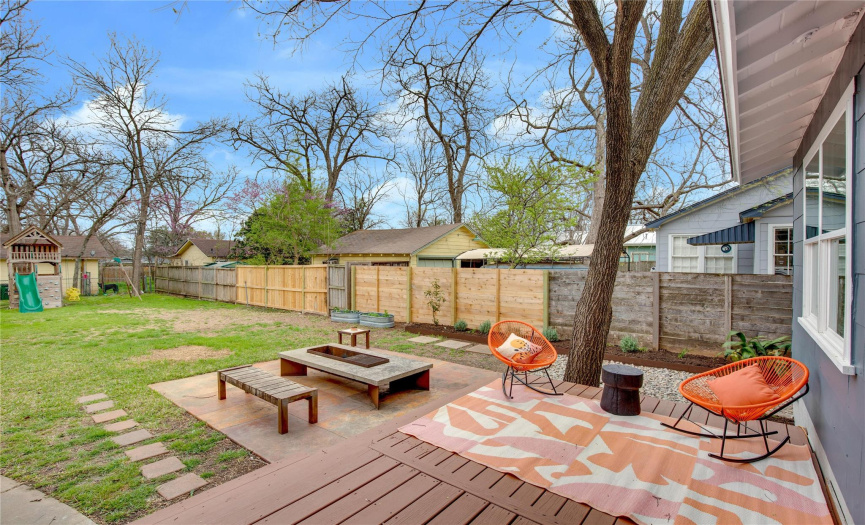Step out onto the back deck and take in the big back yard!  *The playset in the back is no longer there.